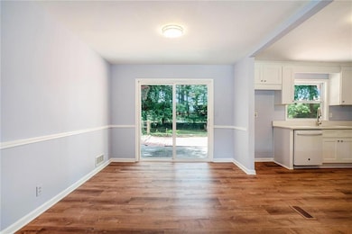 Sliding glass doors lead to rear decking