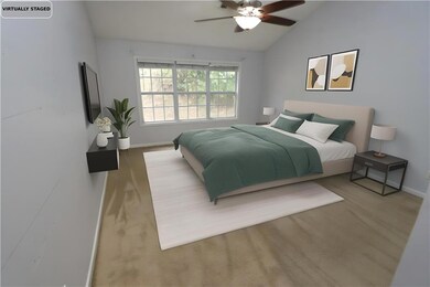 Bedroom featuring vaulted ceiling, ceiling fan, and wood finished floors