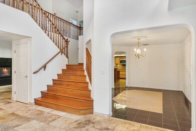 View of staircase and entry