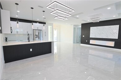 Kitchen featuring a sink, stainless steel applianc