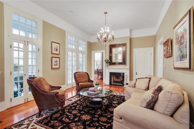 GRAND LIVING ROOM WITH 2 FIREPLACES AND FRENCH DOO
