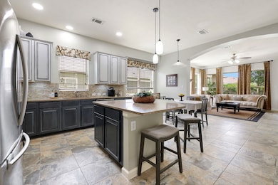 The open kitchen is sleek and functional.