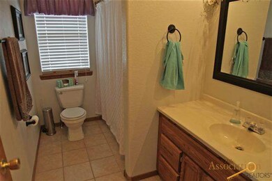 In addition to the private half bath the main bath