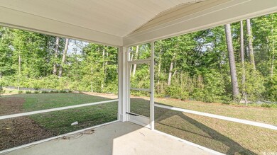 Unfurnished sunroom featuring vaulted ceiling
