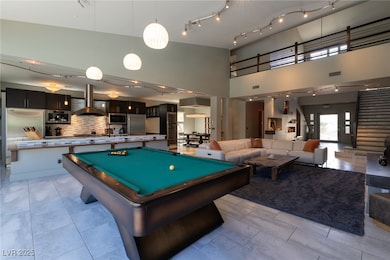 Sophisticated great room with soaring high ceiling