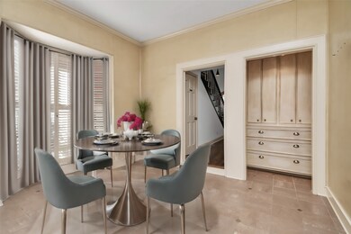 Bask in the warmth of ample natural light in this breakfast area. Note the luxurious bay window, the tiled flooring and storage cabinetry
