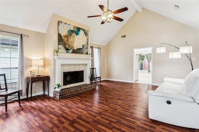 Large living area has vaulted ceilings, laminate f