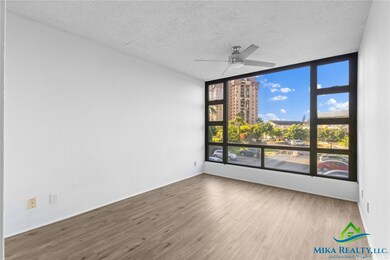 One bedroom facing window *Enhanced Photo