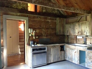 Charming rustic kitchen featuring...