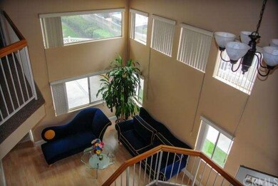 Enter into the formal living room with vaulted cei