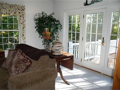 Living Room. French doors open onto...