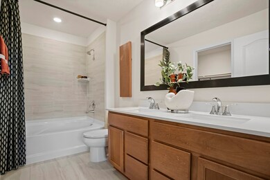 This large primary bath is spacious enough to shar