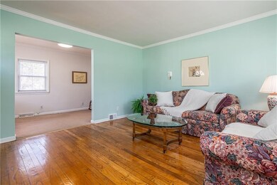 Living room leads to dining room or den.