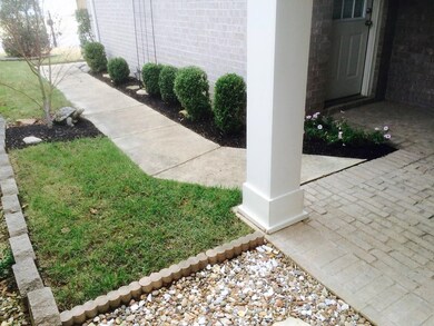 Side yard was landscaped with rock walkway to back