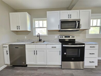 Kitchen featuring sink, appliances with stainless 
