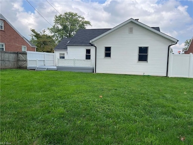 Rear view of house featuring addition to the maste