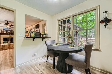 The eat-in kitchen has fantastic views of the parklike yard.
