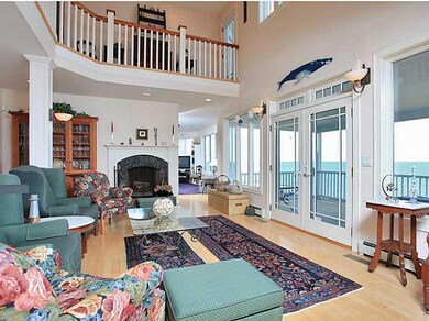Living Room. The two-story living...