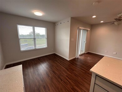 Unfurnished room featuring dark wood-type floorin