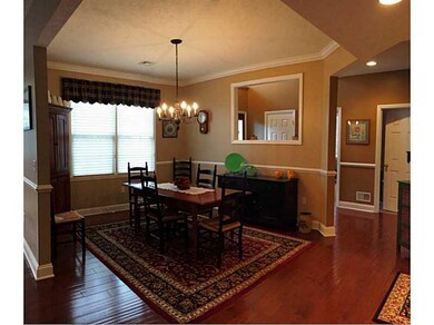 Dining Room. Crown molding, window shades, chair r