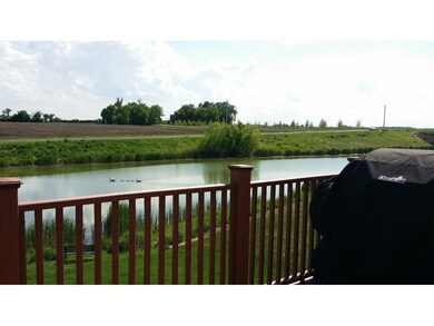 Private back yard view of the pond.