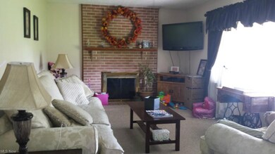 Living room with wood burning fireplace