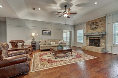 Cozy den area highlighted by extensive millwork, h