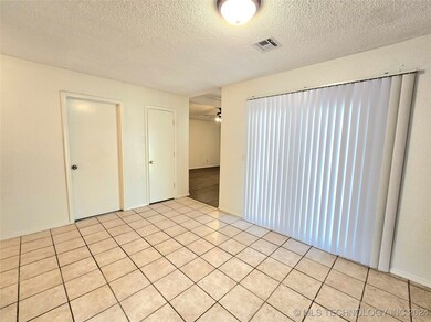 Across is the entry closet and the garage door