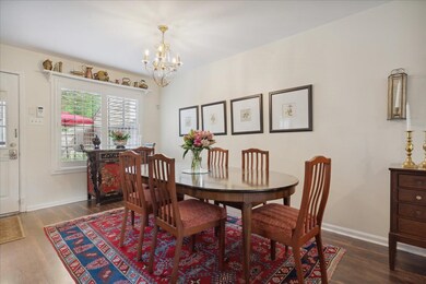 Dining area featuring an inviting chandelier and d