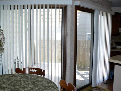 2 Sliding Doors from the dining & kitchen leading 