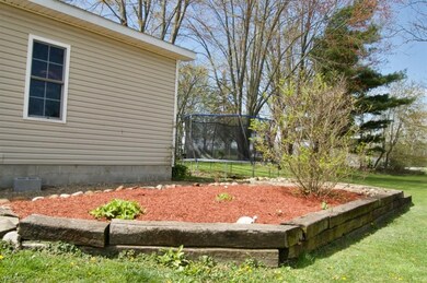 Garden area beside garage