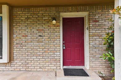 Property entrance with brick siding
