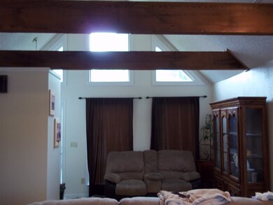 Great room - front windows, beams
