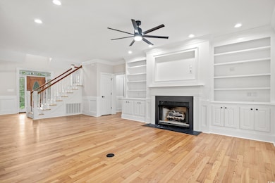 Unfurnished living room with crown molding, a ceil