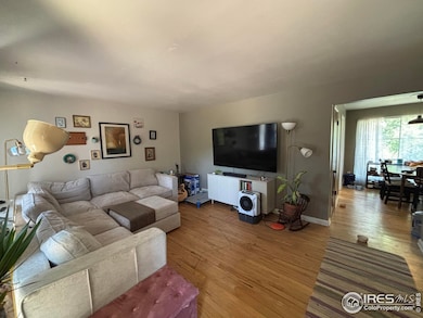Spacious living room and dining room with hardwood flooring.