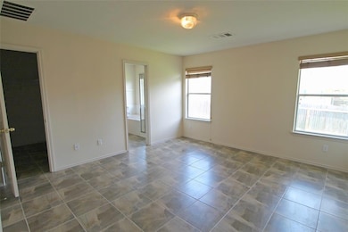 Tiled empty room with baseboards