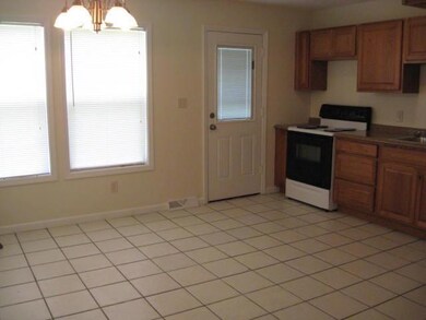 Kitchen features new lighting, windows, cabinets, 