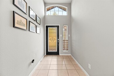 Spacious entryway with high ceilings, decorative t
