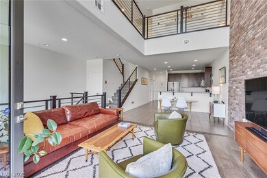 Family room on level 2 with gorgeous brick wall