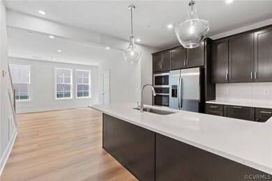 Kitchen with light hardwood / wood-style floors, a