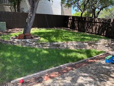 Fenced backyard with a patio