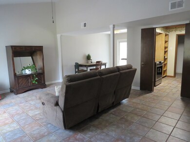 Family room with view of dining area and kitchen