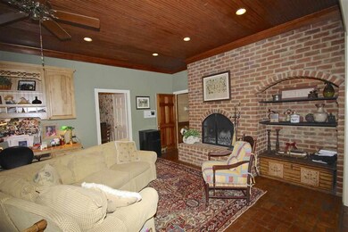 Fabulous hearth room features a bead board ceiling