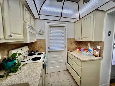Kitchen with solid surface countertops and stone t