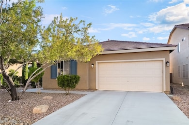 View of front facade featuring stucco siding, driveway, a garage, and a tile roof