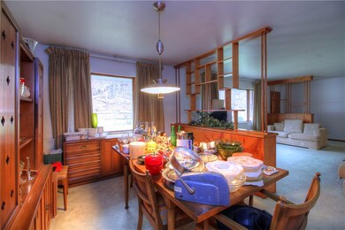 The dining room is separated from the living room