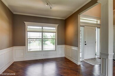 Formal dining with diagonal hardwoods, custom wind
