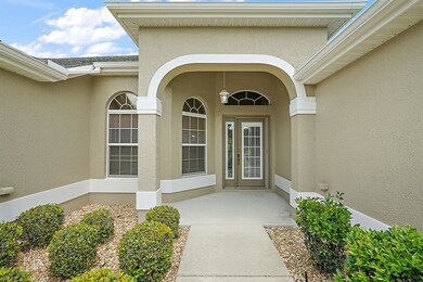 Covered Front Entrance w/ Elegant Glass Front Door