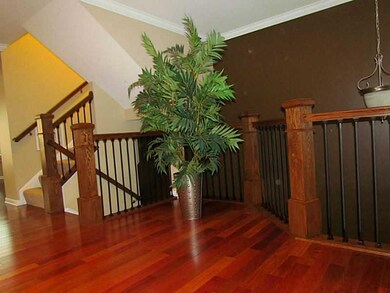 Living Room. Custom crafted banister with impressi