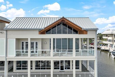 Large wrap-a-round balcony allows wide Bay vistas.